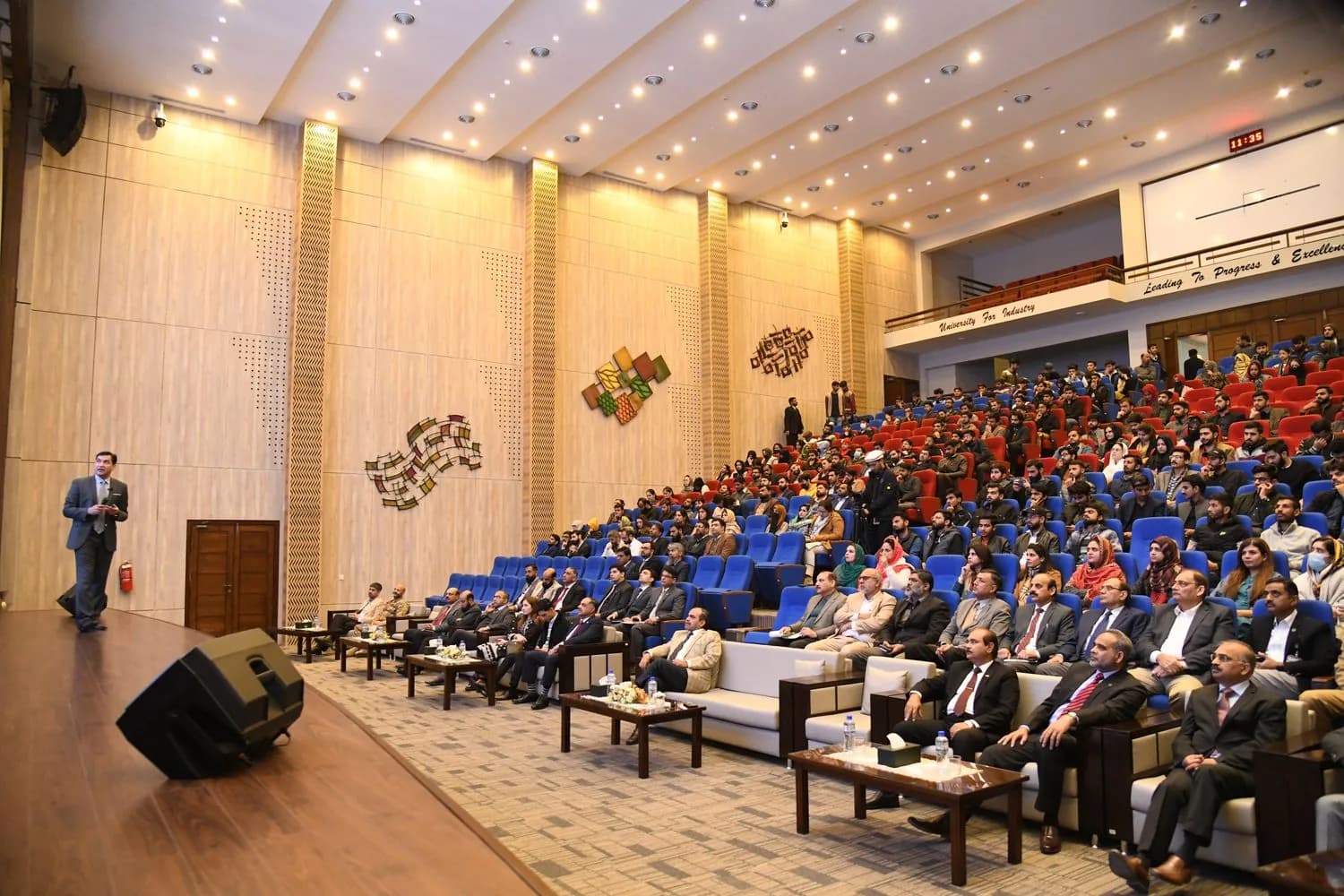 Dr AttiqUr Rehman addressing a university auditorium.